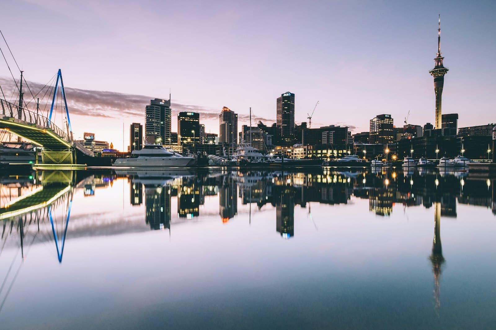 Auckland's waterfront and Sky Tower mirrored in still water