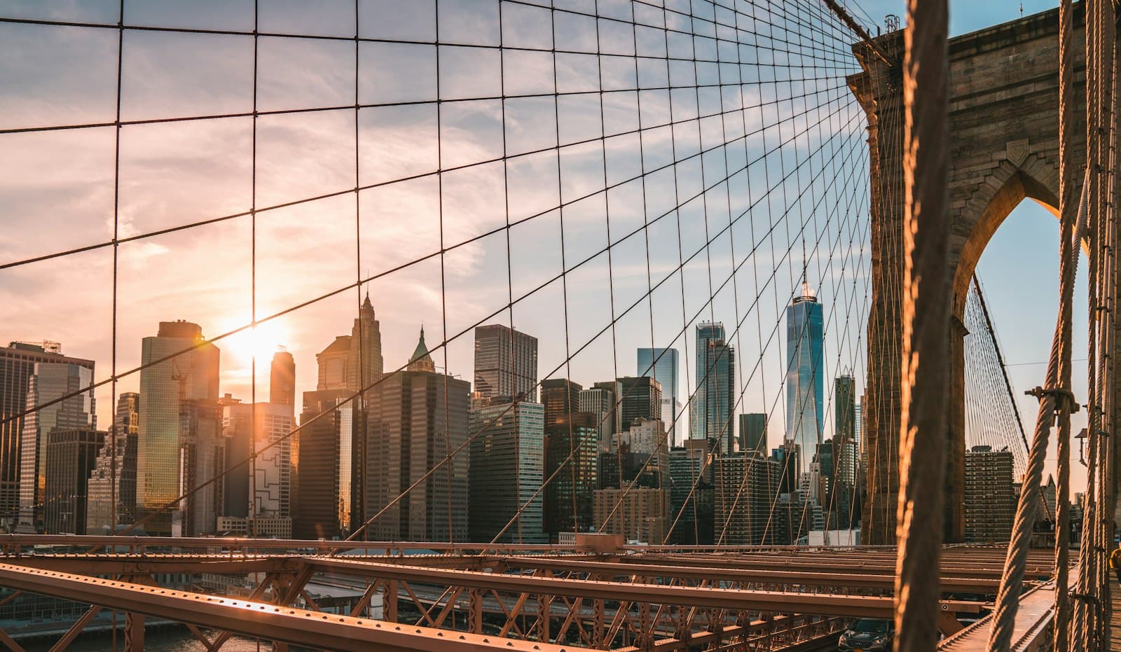 The Manhattan skyline seen from Brooklyn Bridge at sunset